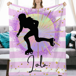 a woman holding a pink and white blanket with a skateboarder on it