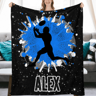 a woman holding a blanket with a basketball player on it