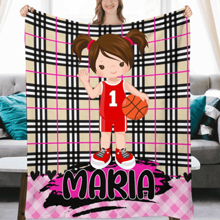 a woman holding a blanket with a picture of a girl holding a basketball