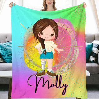 a girl holding a personalized blanket in front of a couch