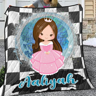 a girl holding up a quilt with a picture of a princess on it