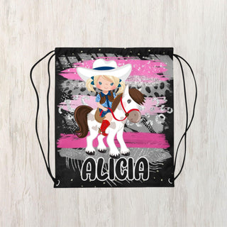 a drawsack bag with a girl riding a horse