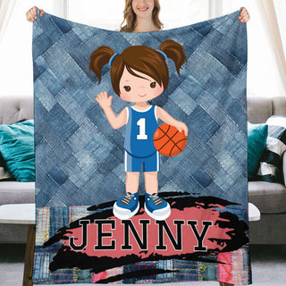 a woman holding a blanket with a picture of a girl holding a basketball