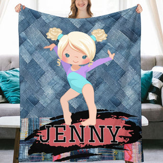 a woman holding a blanket with a picture of a girl on it