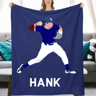 a woman holding a blanket with a picture of a baseball player