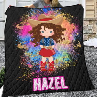 a woman holding a blanket with a picture of a girl wearing a cowboy hat