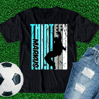 a t - shirt with a soccer ball and a pair of jeans