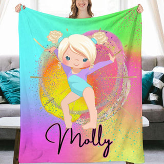 a woman holding up a personalized blanket