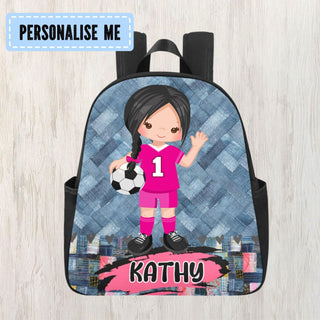 a backpack with a girl holding a soccer ball