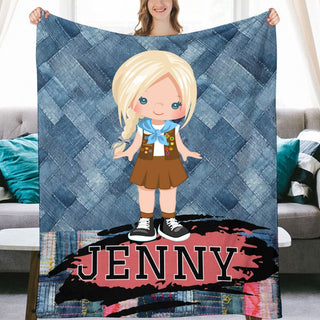 a girl holding up a personalized blanket