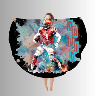 a woman holding a football fan with a picture of a football player on it