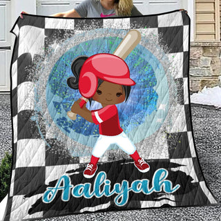 a girl holding a quilt with a picture of a baseball player on it