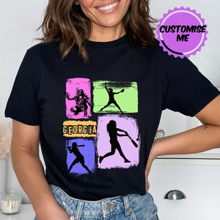 a woman wearing a t - shirt with a picture of a woman holding a baseball