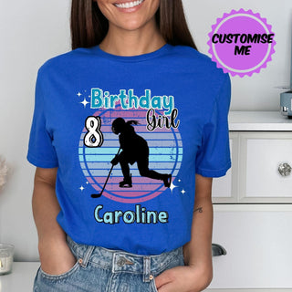 a woman wearing a birthday girl t - shirt