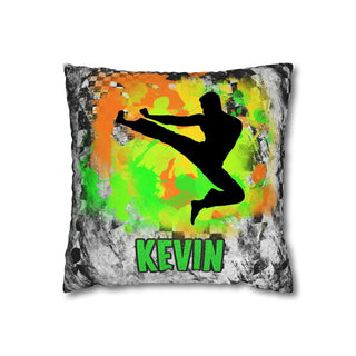 a black and green pillow with a picture of a man doing a kick